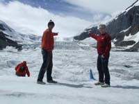 Paul and Dave on the Athabasca Glacier - pointing at nothing (Paul's got one hand in his pocket and the other one's not giving a Hi five)